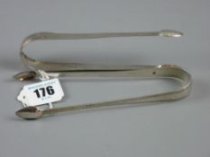 A pair of Georgian silver sugar nips with tapered bright cut handles, 1 troy oz, London 1801 and a