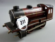 A Marklin R950 clockwork locomotive in red, black and gold livery, marked 'Marklin, Made in Germany'