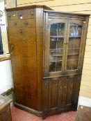 An oak single door hall robe and a reproduction oak Priory style corner cabinet with leaded upper