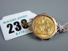 A 1912 full gold sovereign in a nine carat gold mount with non-gold clip and pin, 11.5 grms gross