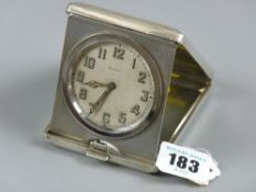 An eight day folding travel clock with engine turned case decoration, Birmingham 1934 with edge