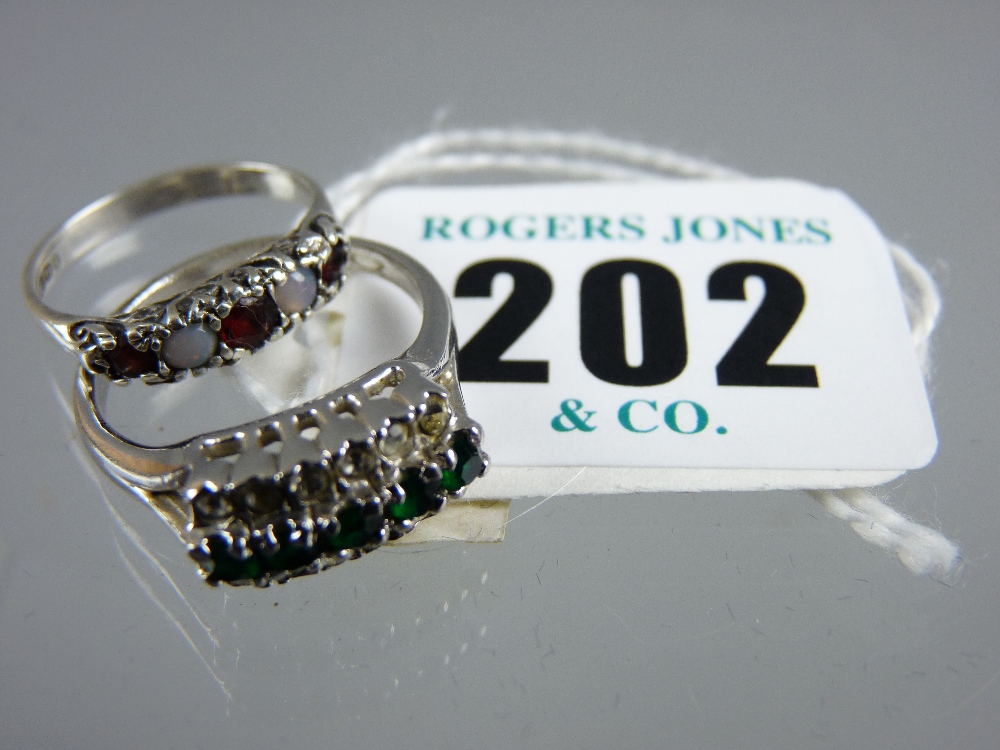 A 20th Century hallmarked silver garnet and white opal dress ring, RJC maker and a white metal dress