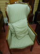 A Sheraton style Edwardian inlaid mahogany wingback armchair with box wood line inlay and Sheraton