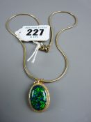 A nine carat gold snake style neck chain, 6 grms with a mounted oval blue opal, 1.6 x 1.1 cms, 9