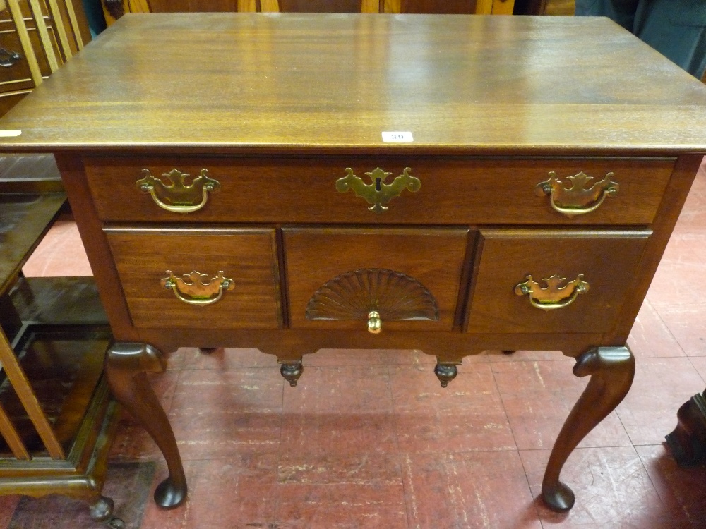 A 20th Century American Chippendale style mahogany lowboy by The Bartley Collection Ltd, interior