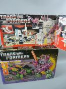 Two Hasbro Takara transformer bases, Autobot Battlestation Metroplex, (original box and liner,