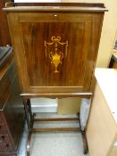 An Edwardian inlaid mahogany secretaire on stand, the rail sided top with moulded edge over a single