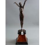 D H Chiparus a reproduction bronze figurine of a dancing girl raised upon a black and pink marble