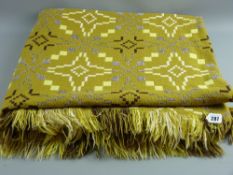 A Welsh woollen blanket, mustard ground with geometric patterns and tasselled ends, 232 x 215 cms