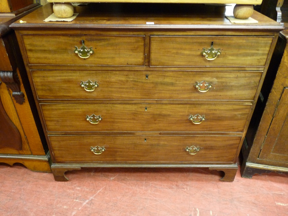 A late Georgian mahogany chest of two short over three long drawers having cockbeaded edges,