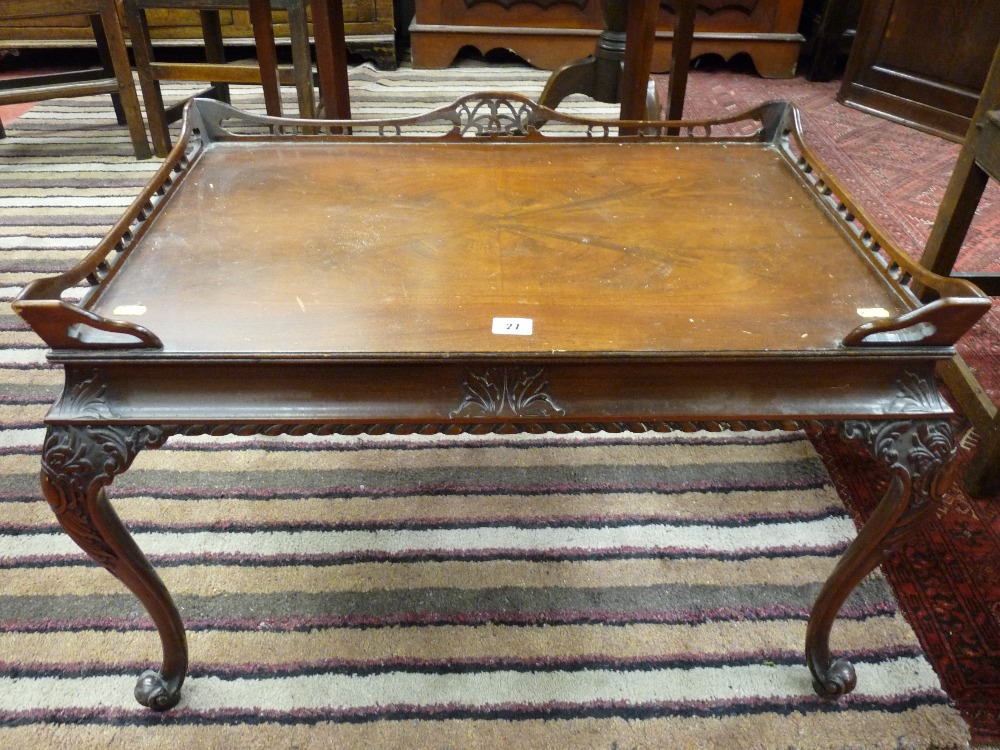 A Chinese style walnut side table, the rectangular top with pierced gallery over opposing side