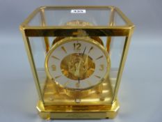 A Jaeger Le Coultre Atmos clock in a brass and glass case, 20th Century Swiss made with presentation