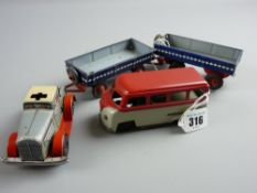 Clockwork tinplate toys - a red and grey camper van marked 'Patent' to the number plate, unknown