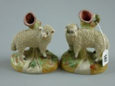 A pair of late 19th Century Staffordshire pottery spillholders modelled as a sheep and a ram