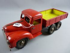 A clockwork tinplate red tipper truck by Blomer & Schuler, BMS logo hubcaps to most wheels, marked