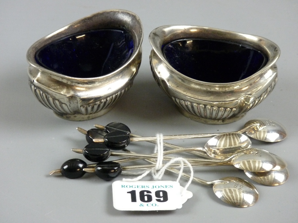 A pair of oval silver salts with Bristol blue liners (damage to one), 2 troy ozs, Chester 1906 and a