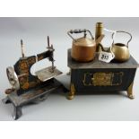 A tinplate cooking stove with brass chimney and brass and copper kettles, 19 cms wide and a German