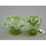 A Victorian vaseline glass jug and bowl set with frilly trailwork decoration