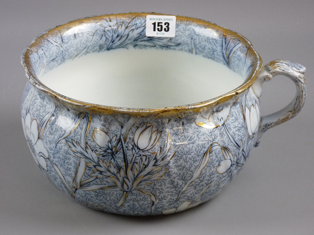 A Victorian floral and gilt decorated chamber pot marked 'Chintz' to the base, 23 cms diameter