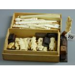 A group of fifteen Oriental carved bone/ivory figures with wooden stands along with a quantity of