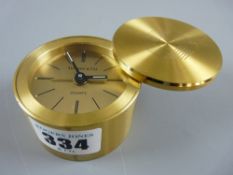 A 20th Century Tiffany & Co cylindrical brass cased Quartz travel alarm clock, marked to the dial '