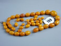 A graduated set of butterscotch amber beads, 43 cms long plus others, 64 grms total weight