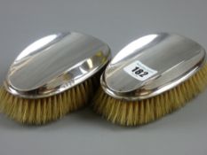 A pair of Birmingham silver gentleman's clothes brushes