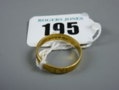 A twenty two carat gold inscribed wedding band, 3.3 grms