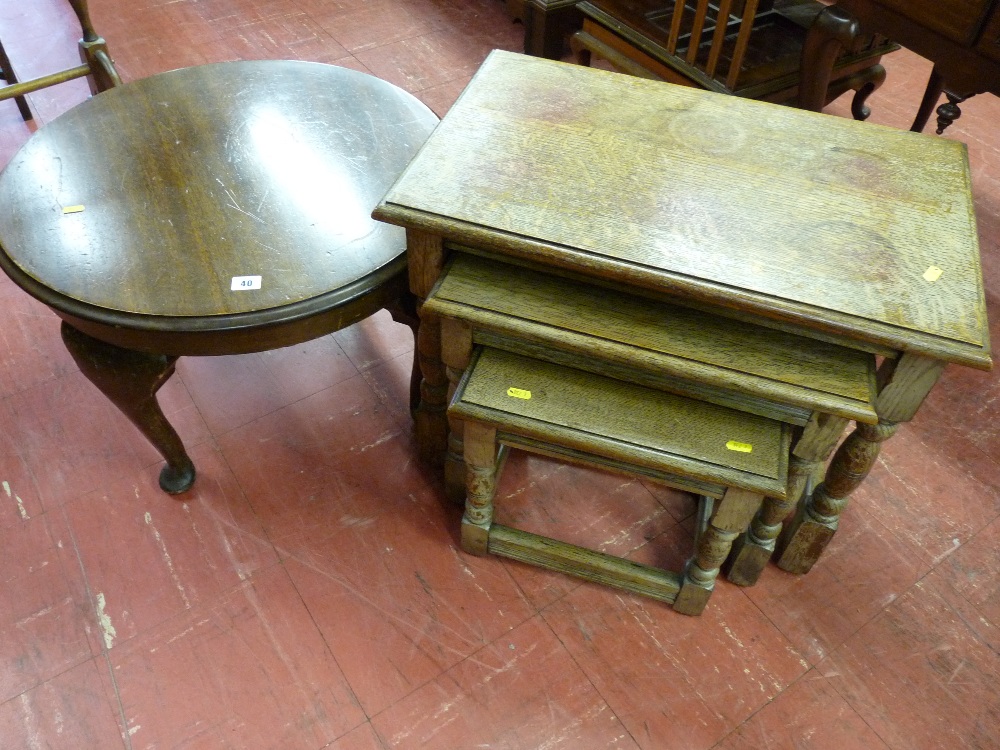 A set of three rustic oak rectangular topped coffee tables and a circular polished coffee table on