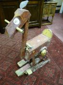 A vintage walking mule, naively carved and painted with a rare and unusual walking action (one