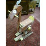 A vintage walking mule, naively carved and painted with a rare and unusual walking action (one