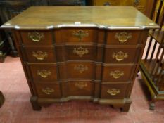 A Federal American style reproduction mahogany chest of four drawers, the moulded top over