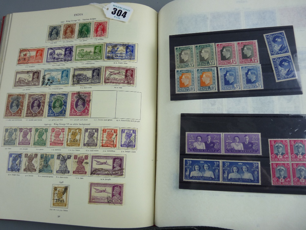 A King George VI stamp album by Stanley Gibbons Ltd, part filled well laid collection within
