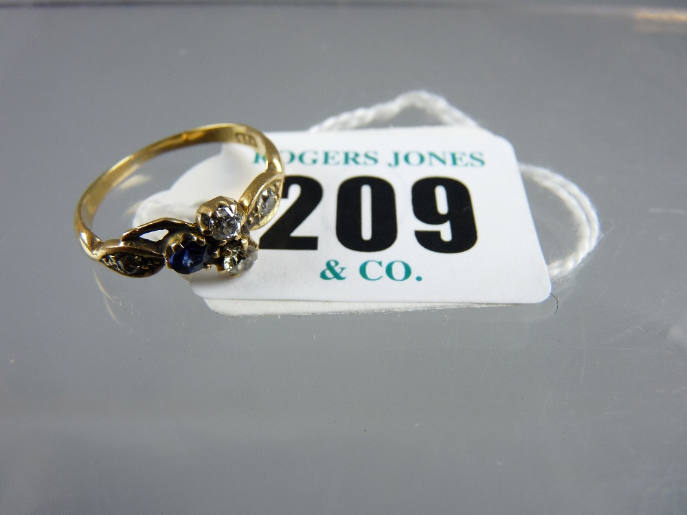 A lady's nine carat gold dress ring having two tiny diamonds of estimated 0.4 carat and with