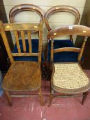 A pair of Victorian mahogany balloon back side chairs with carved centre rail and upholstered drop-