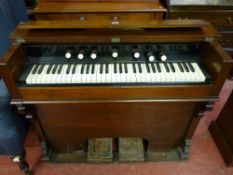A Crane & Sons Ltd mahogany encased pedal organ with iron carrying handles, 85 x 103 cms, 39 cms