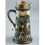 Doulton Lambeth - a silver collared stoneware jug by George Tinworth, 30 cms high, typically