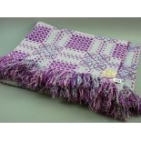 A PURPLE AND PINK LARGE WELSH WOOLLEN BLANKET with tasselled ends, original label 'Made in Wales,