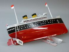 A TWIN FUNNEL TINPLATE CLOCKWORK LINER, a reproduction model of a clockwork driven ocean liner