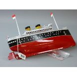 A TWIN FUNNEL TINPLATE CLOCKWORK LINER, a reproduction model of a clockwork driven ocean liner