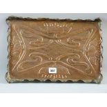 AN ART NOUVEAU COPPER TRAY with raised crimped edge, embossed floral decoration with central