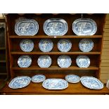 A GOOD SET OF WILLOW PATTERN DRESSER PLATES comprising six meat plates and seventeen dinner