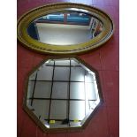 A GILT FRAMED OVAL WALL MIRROR and one other, 85 x 57 cms the largest