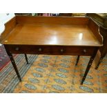 A VICTORIAN MAHOGANY TWO DRAWER WASHSTAND, a 5 ins shaped gallery over a single board top, two