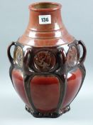 RARE BRETBY COPPERWARE, a 30 cms high vase in a high fired red lustre ground, six handled with