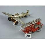 TWO GERMAN TINPLATE TOYS including a US-zone fire engine with tilting ladder, 15 cms, key