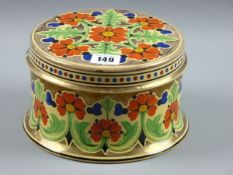 A WEDGWOOD CANE GLAZED POT AND COVER designed by Millicent Jane Taplin, a 19 cms diameter circular