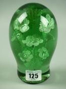 A VICTORIAN GREEN GLASS DUMP PAPERWEIGHT with interior flowers decoration and rough pontil base,