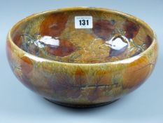 A ROYAL DOULTON AUTUMN LEAVES BOWL, a 25 cms diameter bowl with all over mottled ground with incised