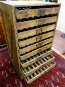 A VINTAGE PINE APPLE STORAGE RACK by E H Taylor Ltd, nine slide-out slatted base drawers within a